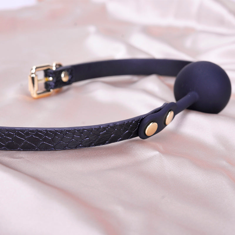 Side view of silicone ball gag with textured strap