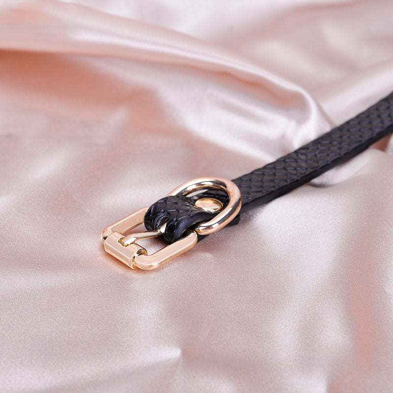 Croc-embossed strap detail on silicone ball gag