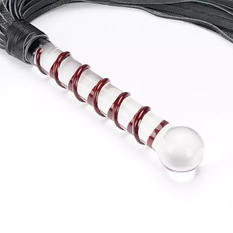 Black leather flogger with glass handle close-up