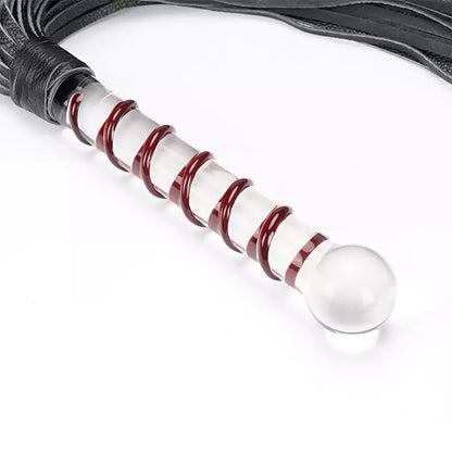 Black leather flogger with glass handle close-up