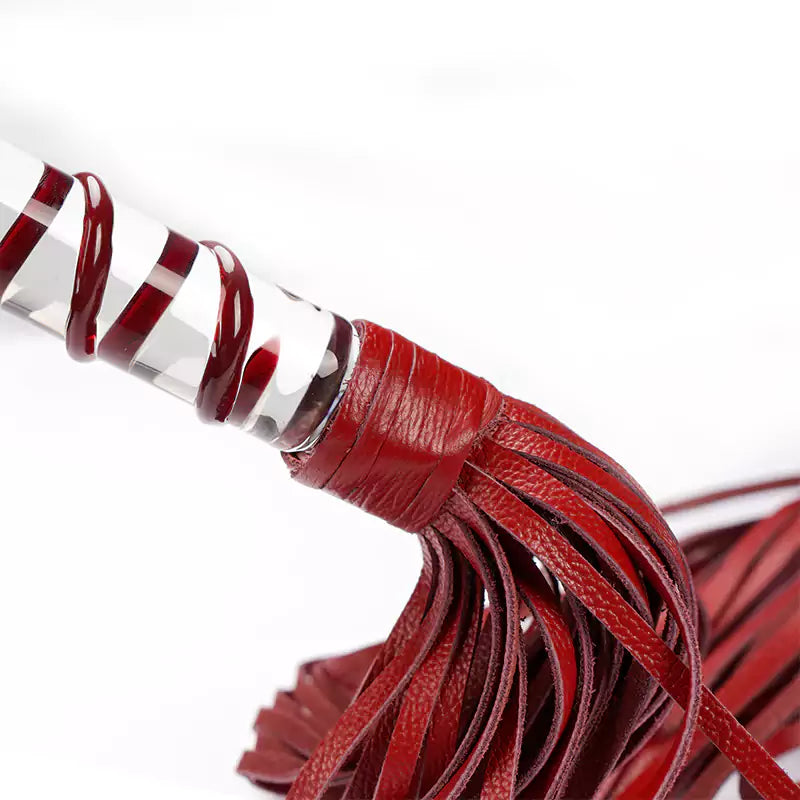 Close-up of genuine leather falls on red flogger