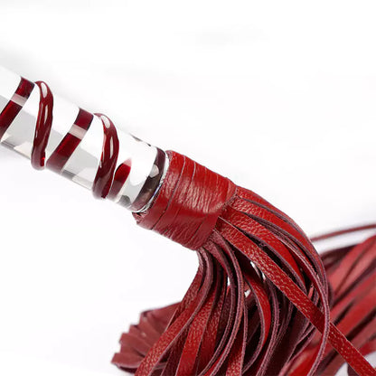 Close-up of genuine leather falls on red flogger