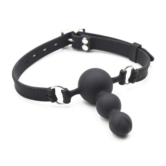 full view of black dual-use silicone ball gag showing elongated mouthpiece and adjustable straps