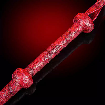 Detail of handwoven handle and wrist strap in red setting