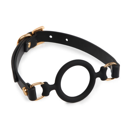 Side view of the black Eye of Horus ring gag showing its open silicone ring structure