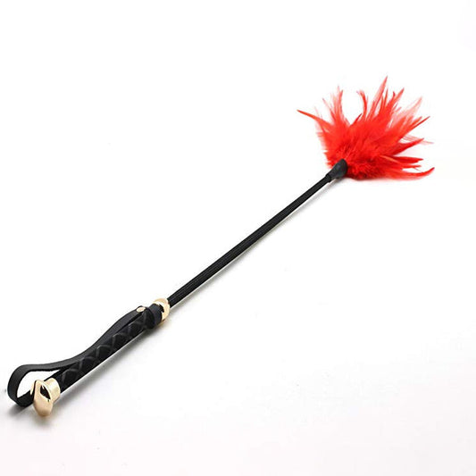 Red feather leather riding crop with gold hardware full view