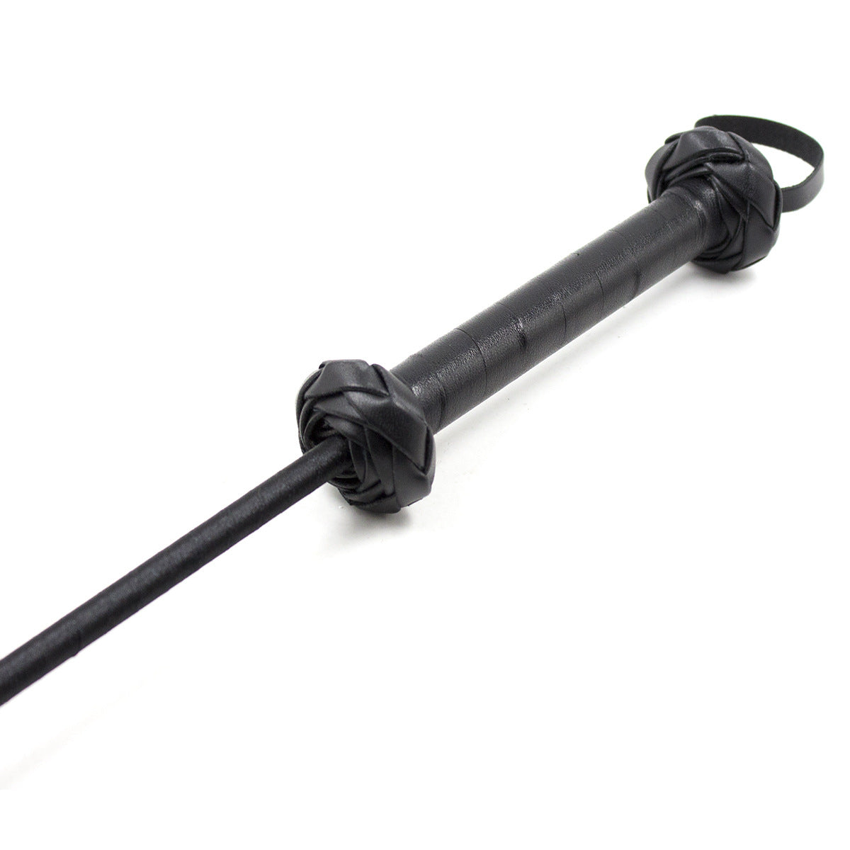 Close-up detail of the handle on the feline silhouette riding crop