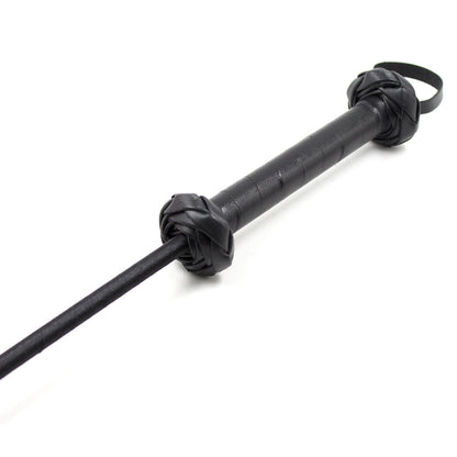 Close-up detail of the handle on the feline silhouette riding crop
