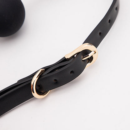 Slim strap adjustment buckle detail with gold-tone finish