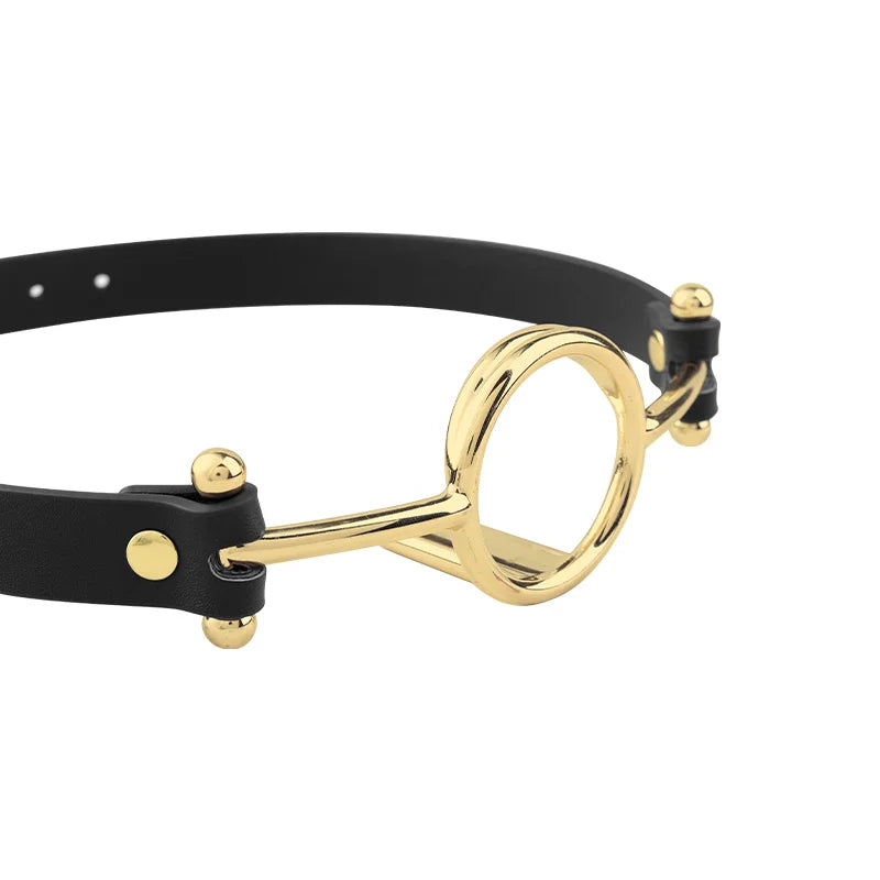 close-up of polished gold-tone O-ring hardware maintaining fixed open-mouth positioning