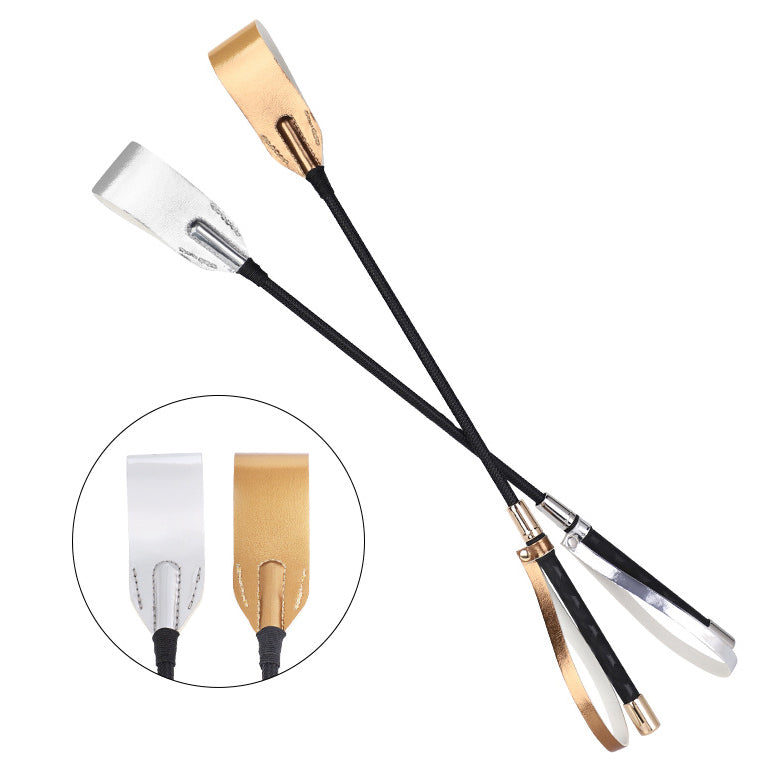 Gold and silver metallic riding crops together side by side comparison