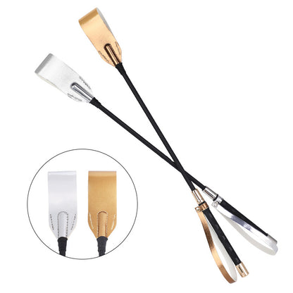 Gold and silver metallic riding crops together side by side comparison