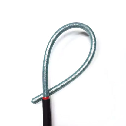 Close-up detail of green acrylic discipline cane with smooth acrylic finish