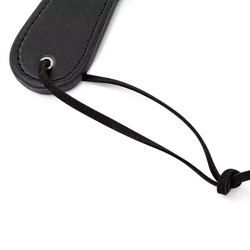 Detail of wrist loop on plush heart paddle