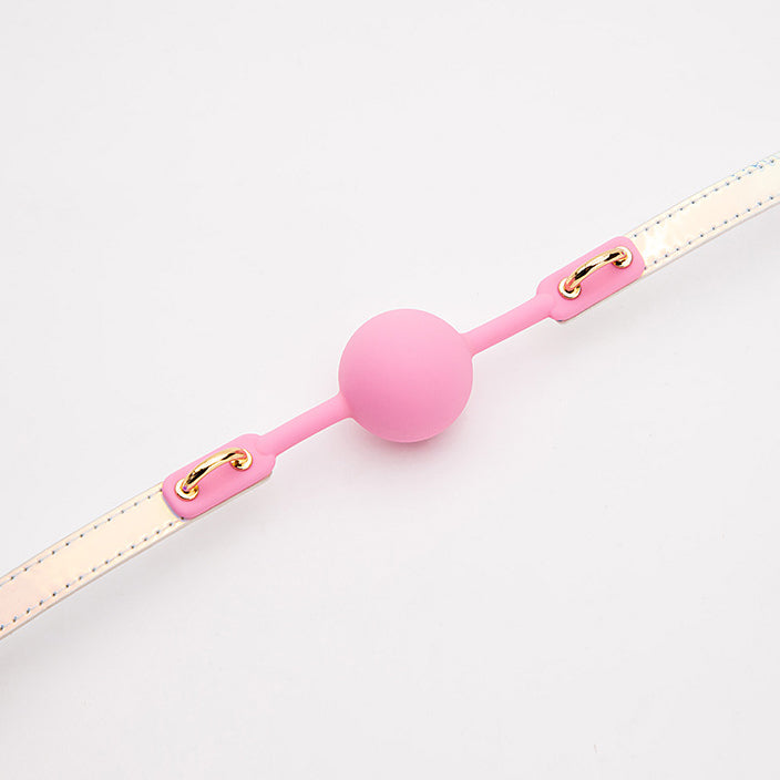 Detailed view of the iridescent bondage ball gag construction and colorful design