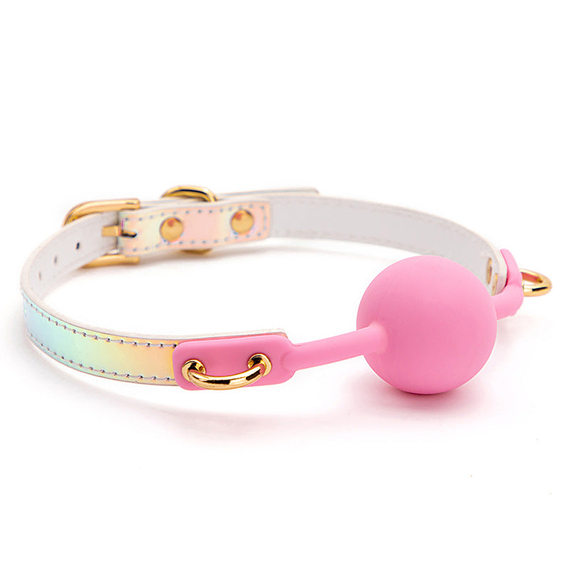 Right side view of the iridescent ball gag showing its rainbow strap and pink latex ball