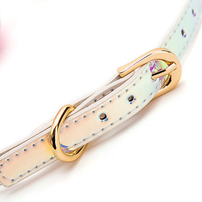 Close-up of the rainbow iridescent strap on the pink latex bondage ball gag
