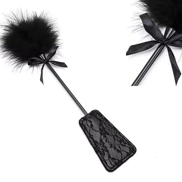 Close-up detail of black lace feather square spanking paddle surface texture