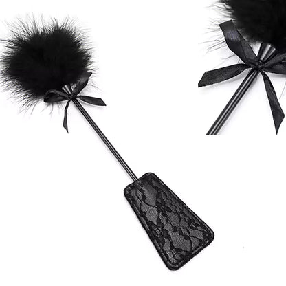 Close-up detail of black lace feather square spanking paddle surface texture