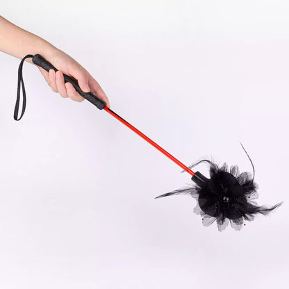 Lace flower riding crop held in hand showing size and grip