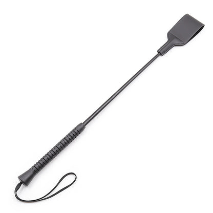 Back view of leather riding crop showing shaft alignment and handle grip