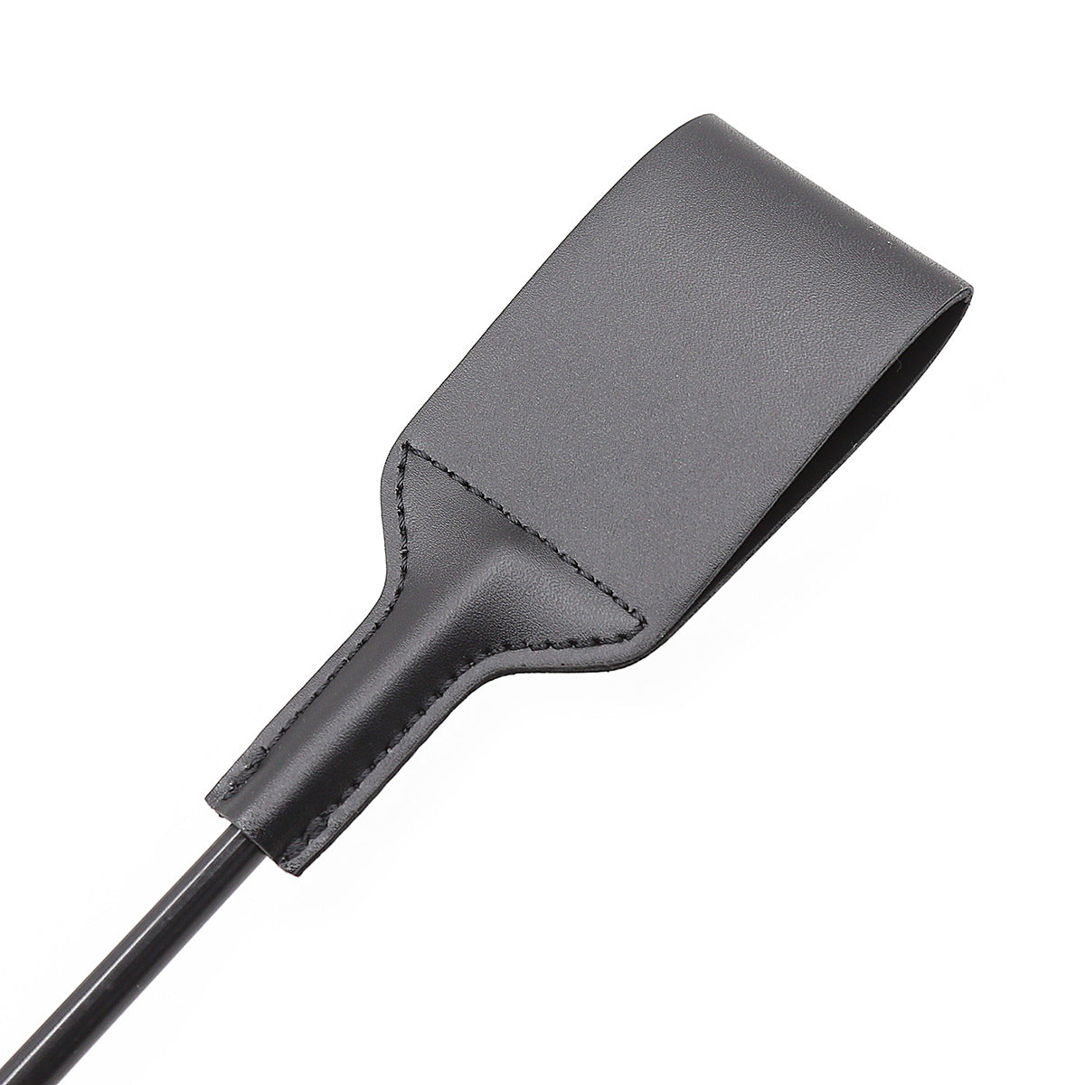 Close-up of leather riding crop striking surface back with stitching detail