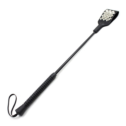 Studded head leather riding crop full view showing metal rivet design