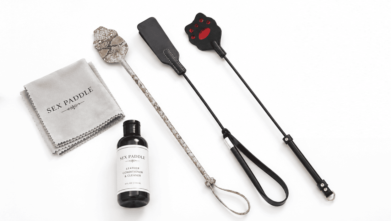 Leather riding crops care setup with dry cloth and flat storage.