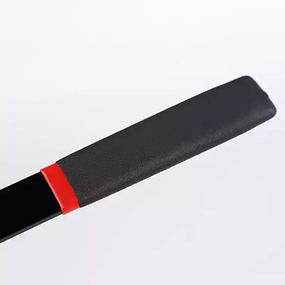 Close-up of widened grip handle on matte acrylic discipline cane