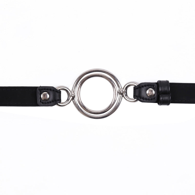 close-up of dual-diameter metal ring illustrating size variation and polished finish