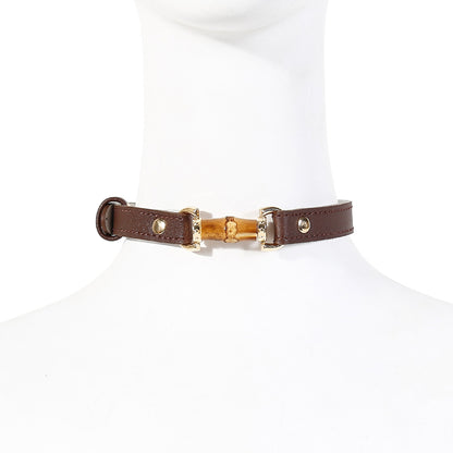 Alternative worn view of the natural bamboo ball gag with polished bamboo bar mouthpiece