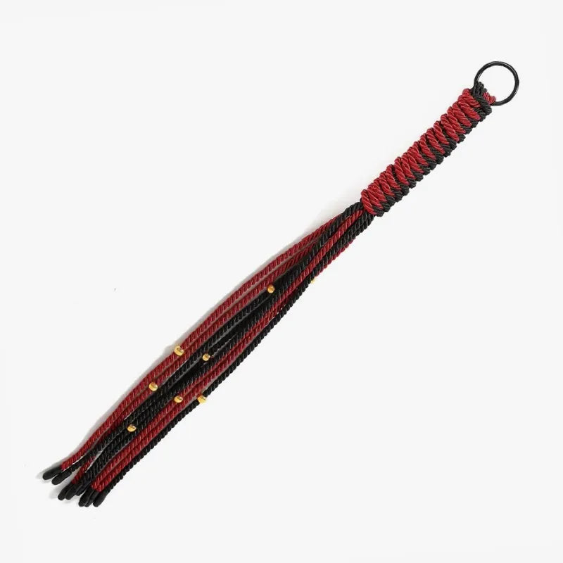 Red and black nylon BDSM flogger full front view