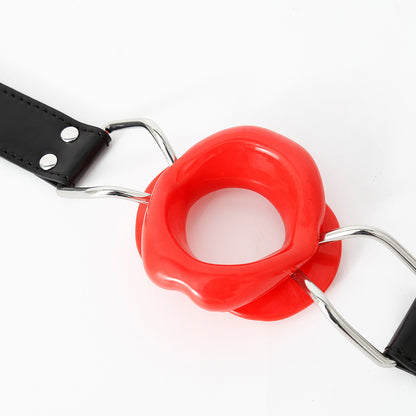 Close-up detail of the red sculpted silicone lip frame on the open mouth gag