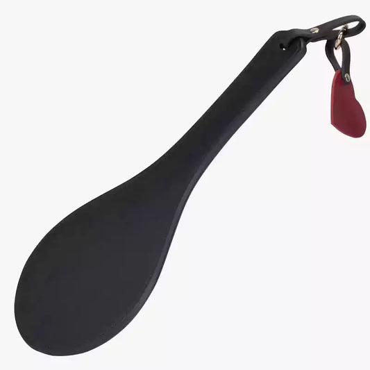 Oval full-grain leather spanking paddle with red heart charm full view