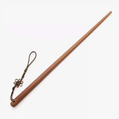 Padauk hardwood teaching cane full view showing tapered profile and natural wood tone