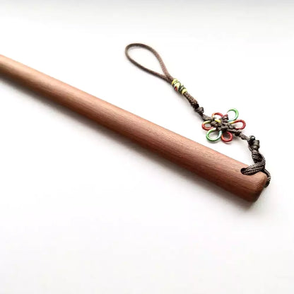 Close-up of padauk hardwood teaching cane handle end showing wider diameter