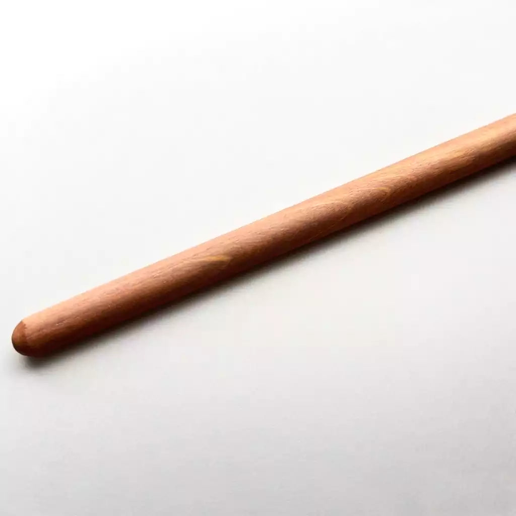 Close-up of tapered tip on padauk hardwood teaching cane