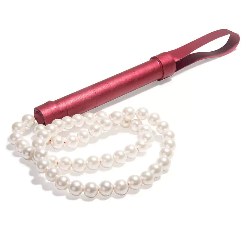 Close-up of synthetic pearl bead tails