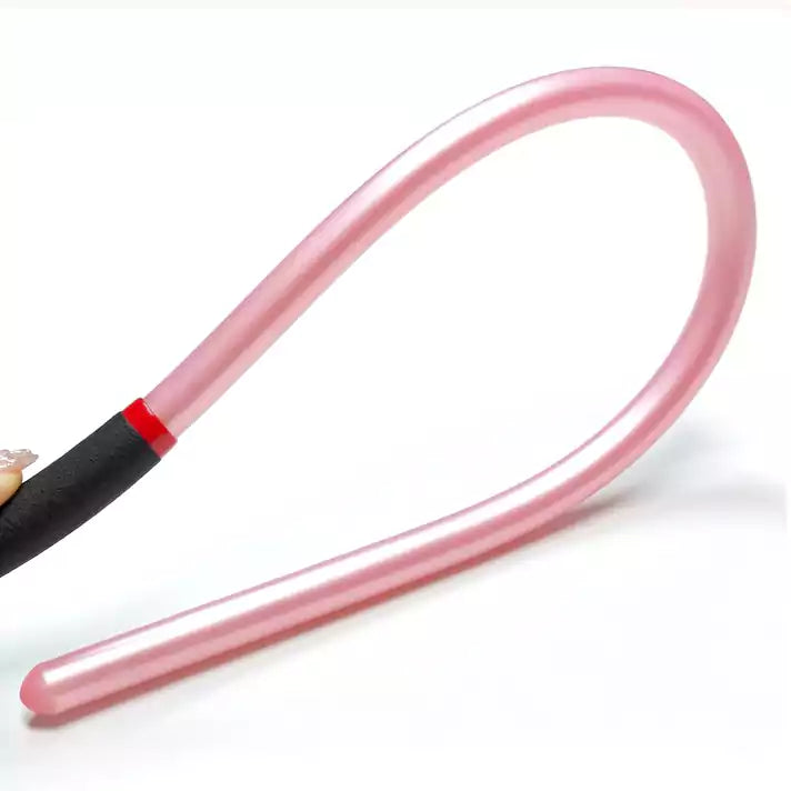 Pink acrylic discipline cane bent to show flexible shaft design