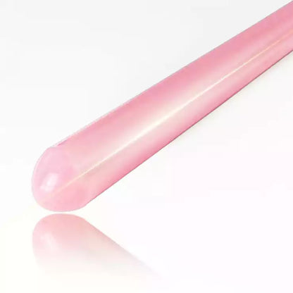 Close-up detail of pink acrylic discipline cane showing smooth finish