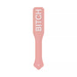 pink silicone paddle with BITCH raised letters