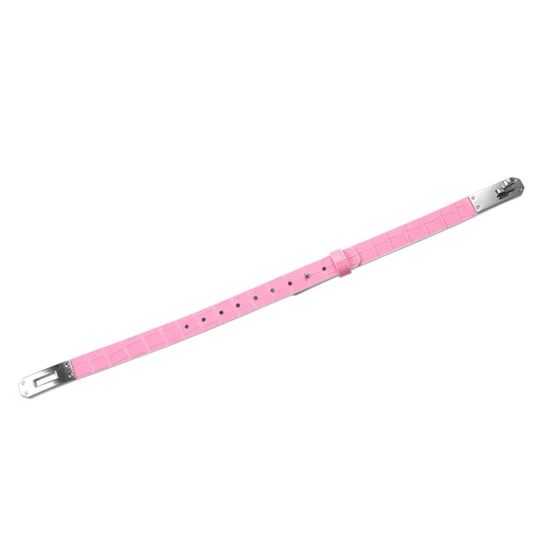 Pink crocodile-pattern collar laid open to show its contrasting lining