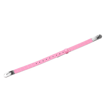 Pink crocodile-pattern collar laid open to show its contrasting lining