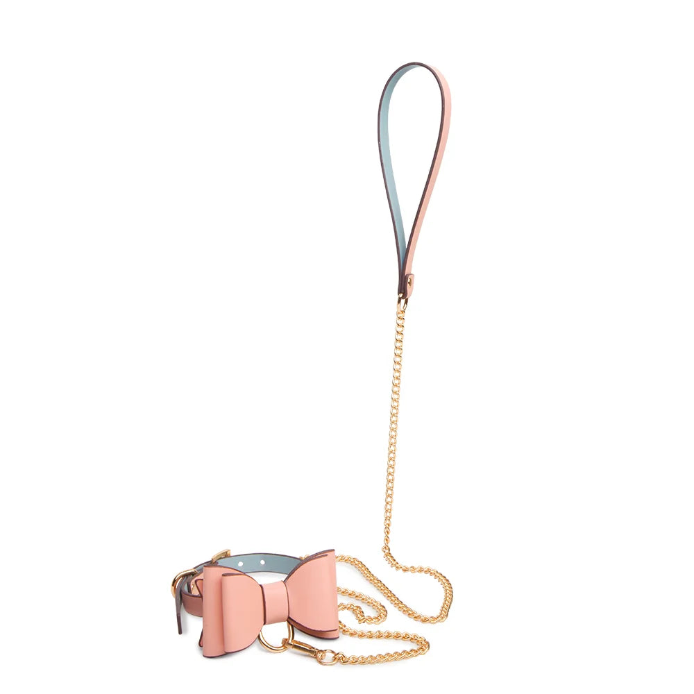 Pink faux leather bow collar with leash angled display