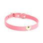 Front detail of pink leather collar with gold heart charm