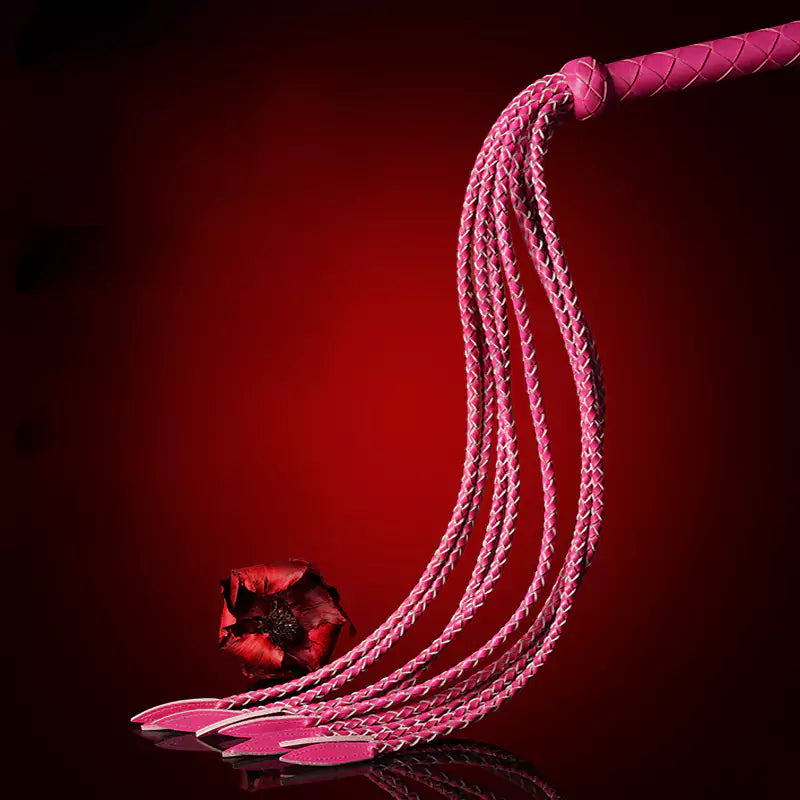 pink leather nine-tail flogger showing braided strands