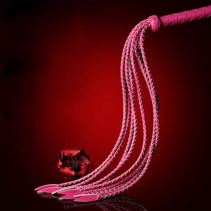 pink leather nine-tail flogger showing braided strands