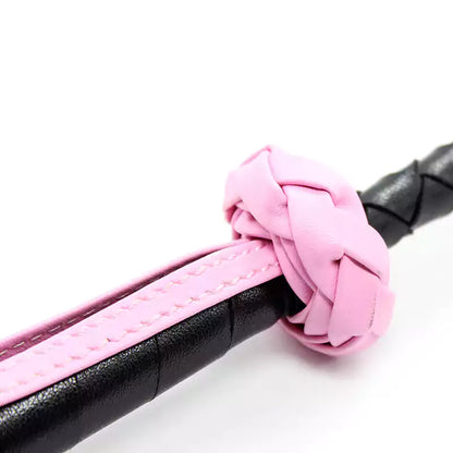 Close-up of shaft connection on pink star handwoven riding crop