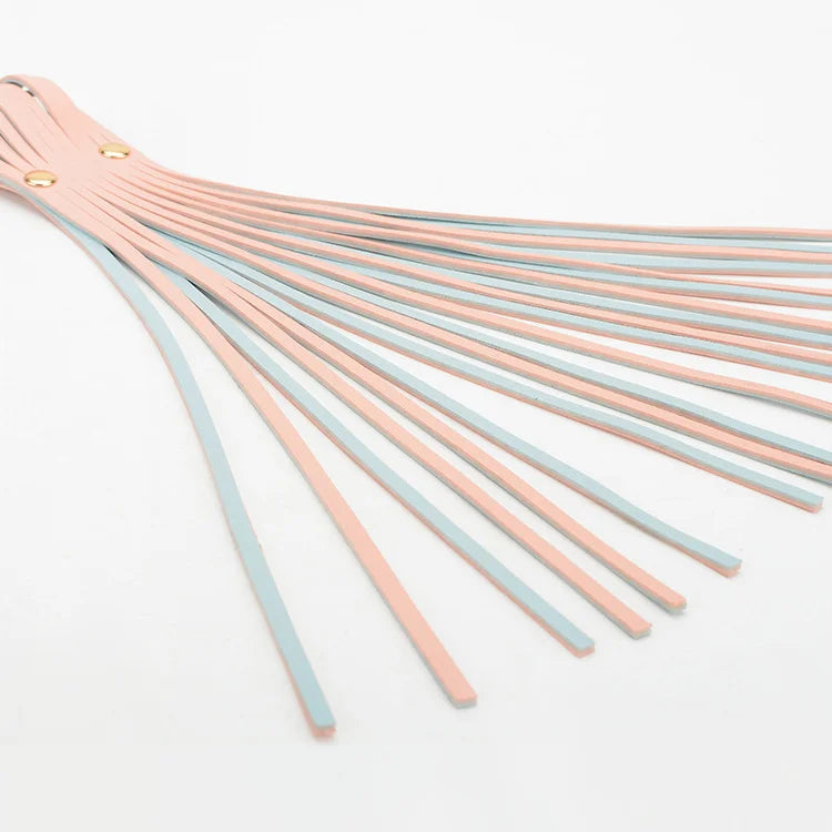 close-up of pink faux leather single-fall strap