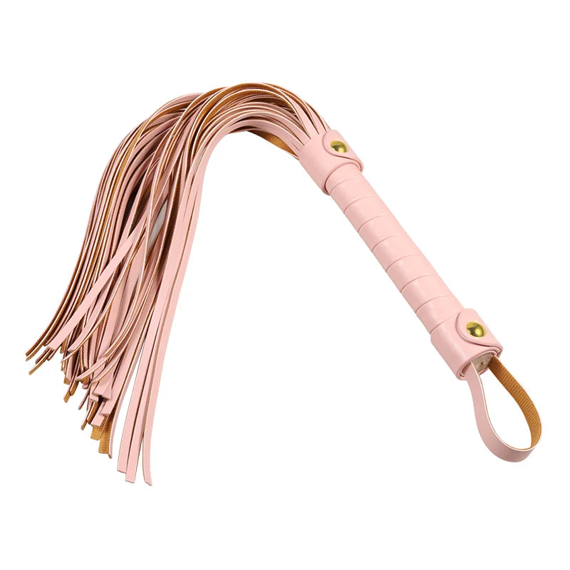 Pink faux leather tassel flogger displayed at angled perspective